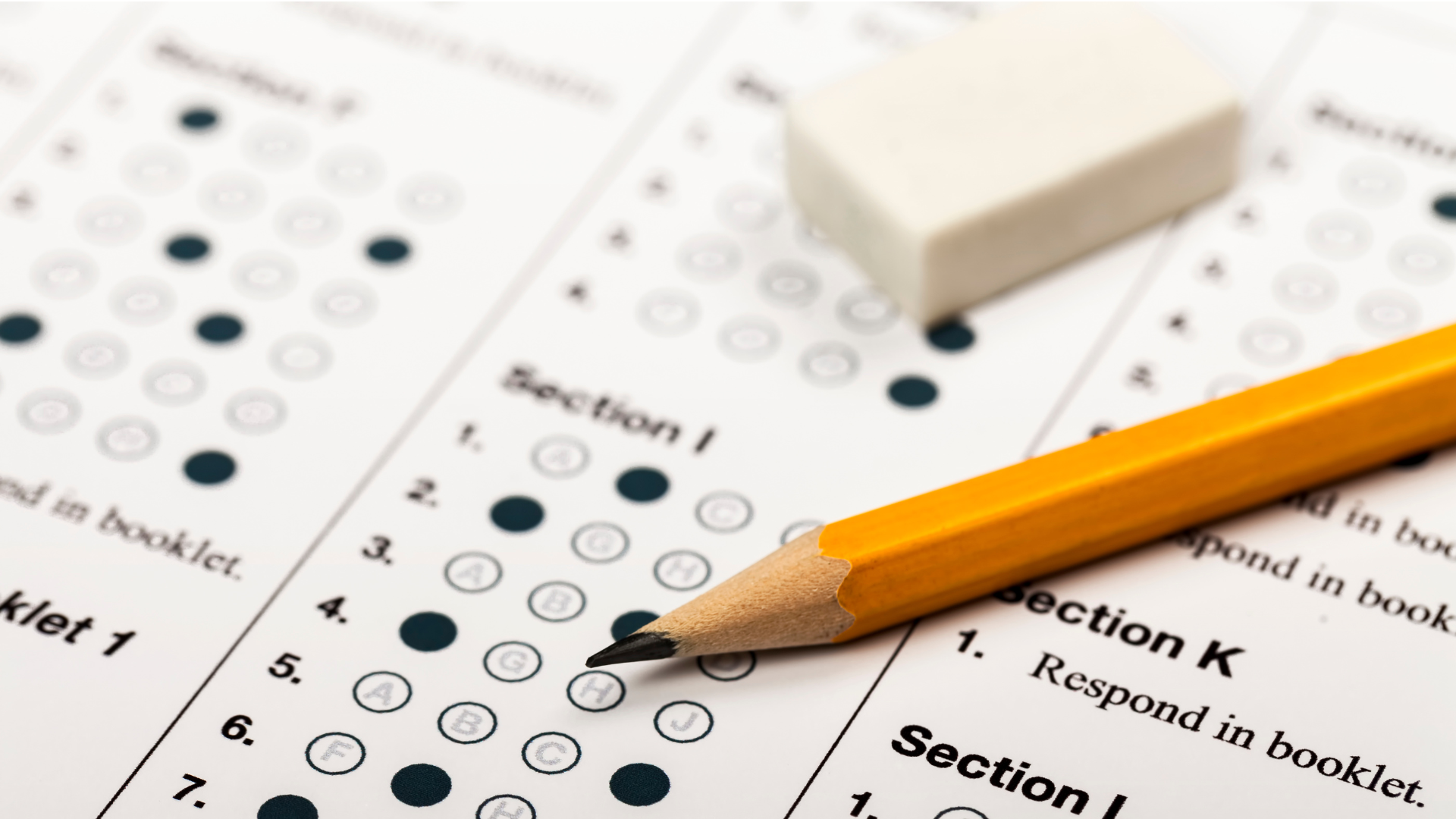 An eraser and a pencil lay on top of a scantron card