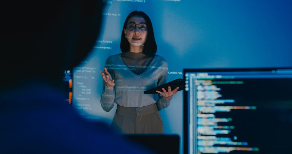 Asia female software developer mentor leader manager talk strategy plan to executive write prompt AI